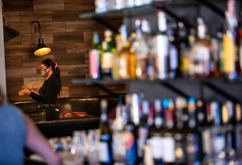 Bartender Scarlett Brock talks with customers at Spaghetty Western in the Southern Highlands ar ...