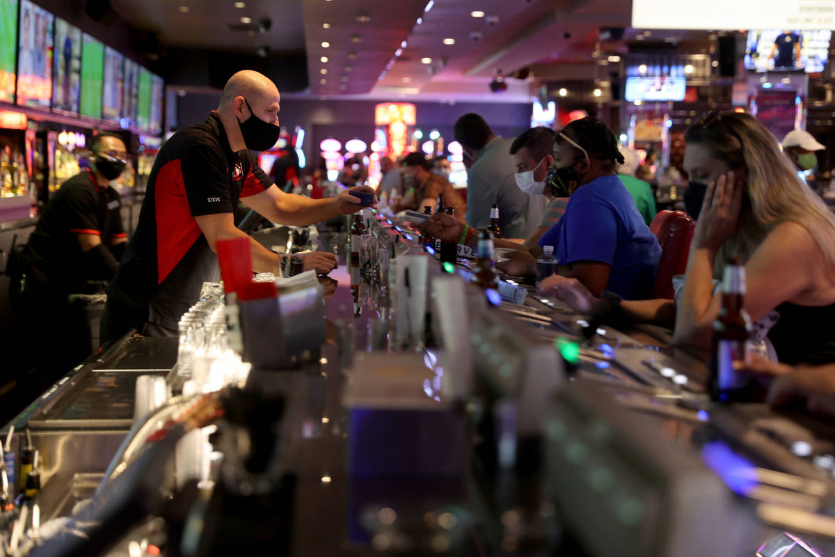 Steve, who declined to give his last name, serves drinks at Longbar at D Las Vegas Friday, July ...