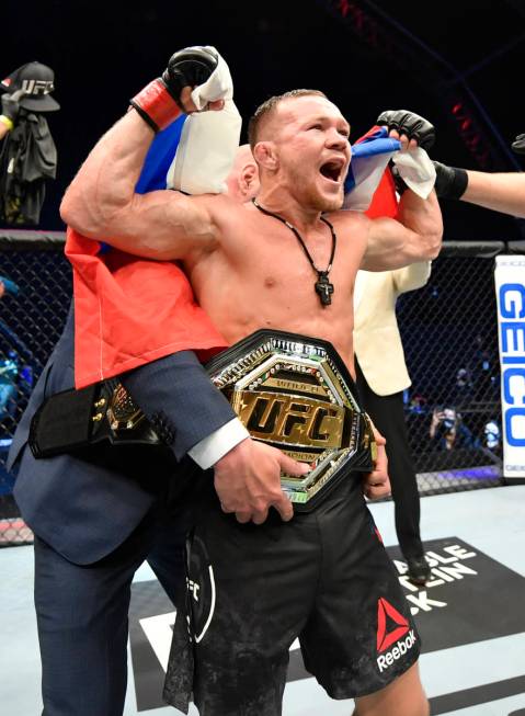 Petr Yan of Russia celebrates after his TKO victory over Jose Aldo in their UFC bantamweight ch ...