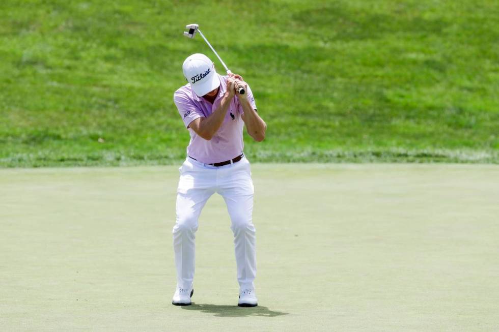 Justin Thomas reacts after missing a putt on the 18th hole during the final round of the Workda ...
