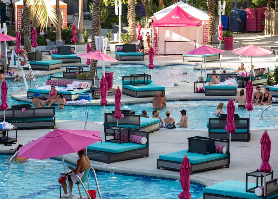 Guests cool off from the 113-degree heat at Flamingo Las Vegas on Sunday, July 12, 2020, on the ...