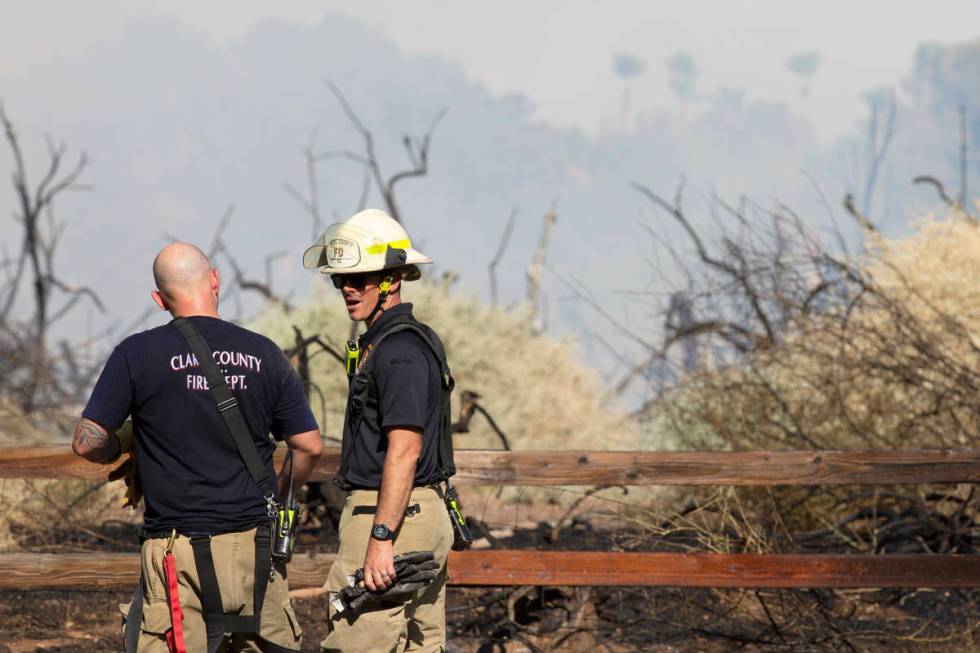 Clark County and Henderson Fire Departments respond to an outside fire on South Pecos Road next ...