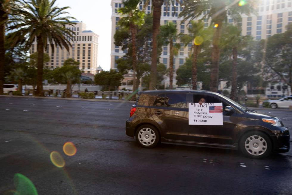 One member of the caravan for Vanessa Guillen holds a sign saying "we want justice for Vanessa, ...