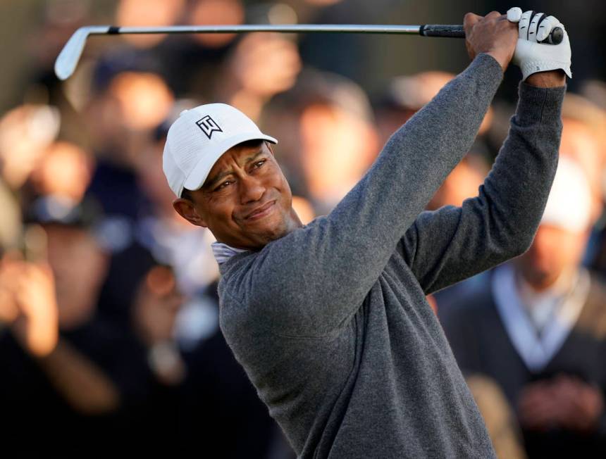 FILE - In this Feb. 14, 2020, file photo, Tiger Woods tees off on the 10th hole during the seco ...