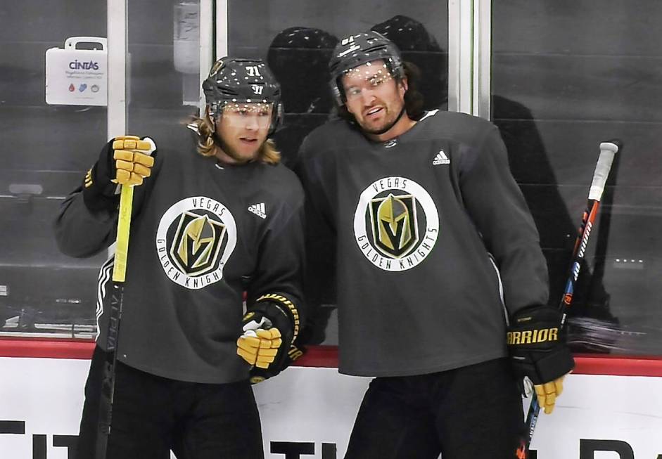 Vegas Golden Knights center William Karlsson (71), left, talks with right wing Mark Stone (61) ...