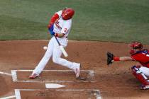 Philadelphia Phillies' Bryce Harper bats as Andrew Knapp catches during an intrasquad baseball ...