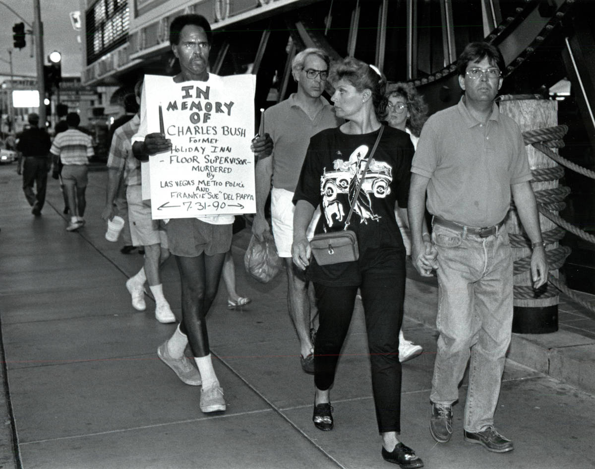 Sekou Kala, left, marches during a solitary vigil in memory of Charles Bush in 1990. (Las Vegas ...