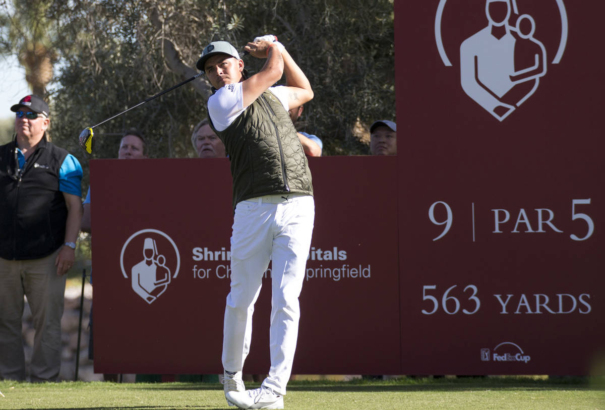 Rickie Fowler watches his drive from the ninth tee box during the first round of the Shriners H ...