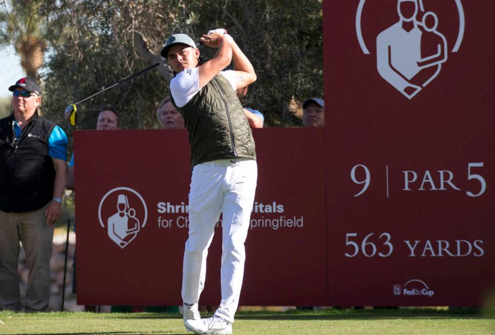 Rickie Fowler watches his drive from the ninth tee box during the first round of the Shriners H ...