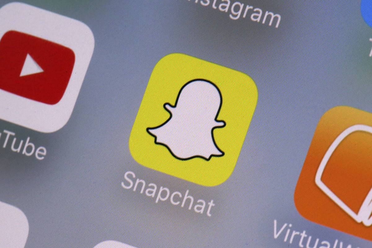 FILE- This Aug. 9, 2017, file photo shows the Snapchat app on a mobile device. (AP Photo/Richar ...