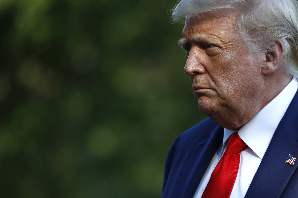 President Donald Trump walks on the South Lawn of the White House in Washington, Wednesday, Jul ...