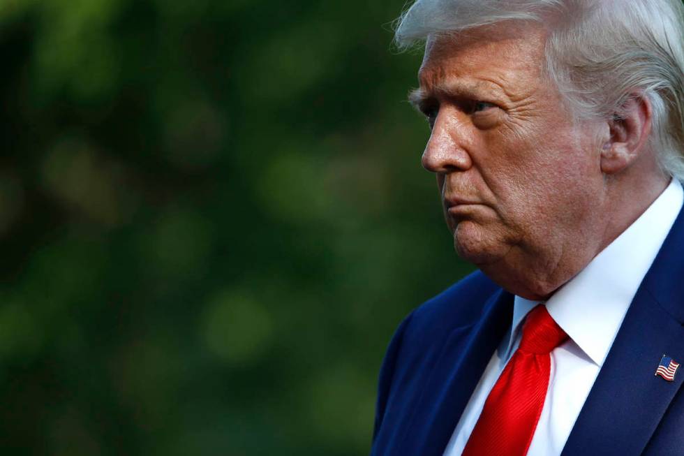 President Donald Trump walks on the South Lawn of the White House in Washington, Wednesday, Jul ...