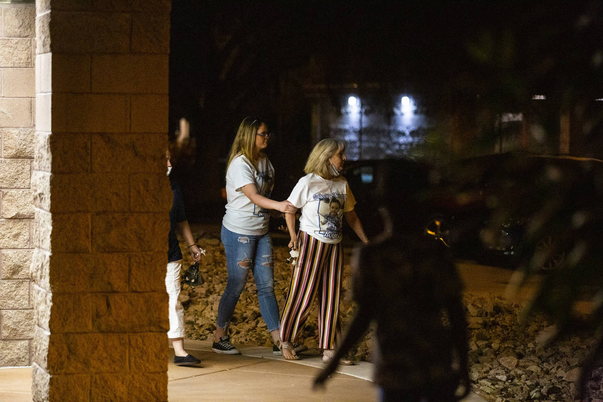 A woman is held back as an argument breaks out during a vigil at Buckskin Basin Parkin Las Vega ...