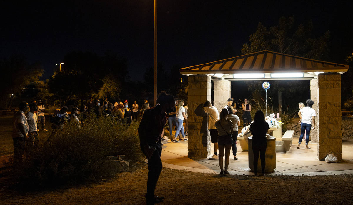 An argument breaks out during a vigil at Buckskin Basin Parkin Las Vegas on Thursday, July 16, ...