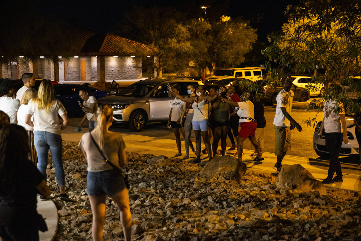 An argument breaks out during a vigil at Buckskin Basin Parkin Las Vegas on Thursday, July 16, ...