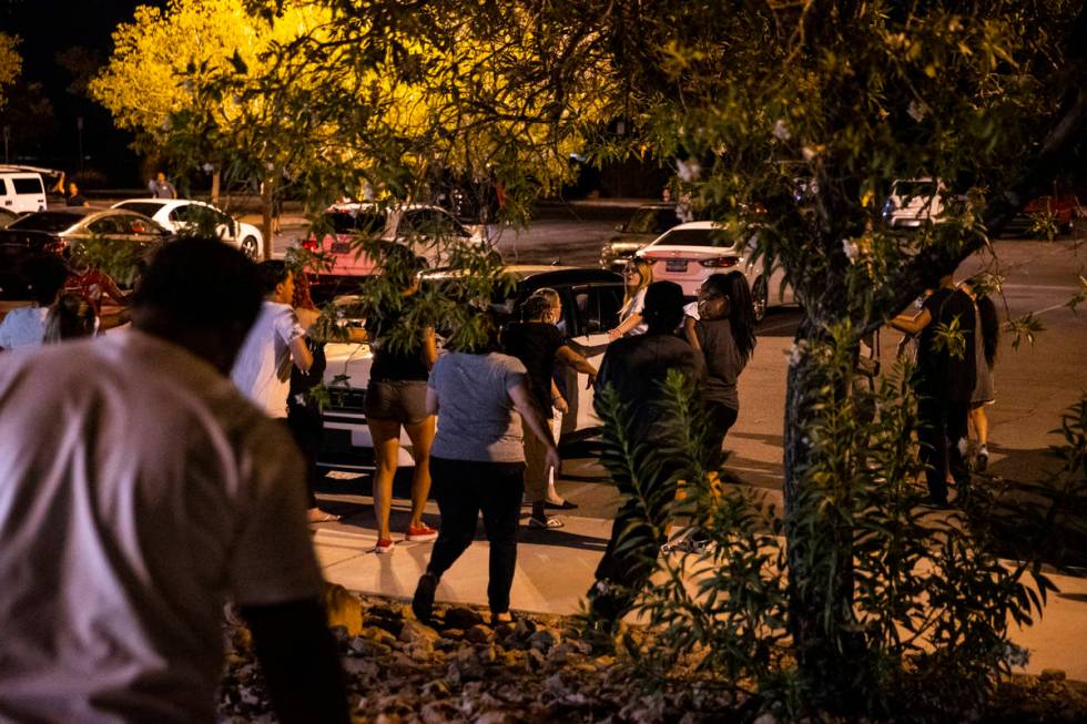 An argument breaks out during a vigil at Buckskin Basin Parkin Las Vegas on Thursday, July 16, ...