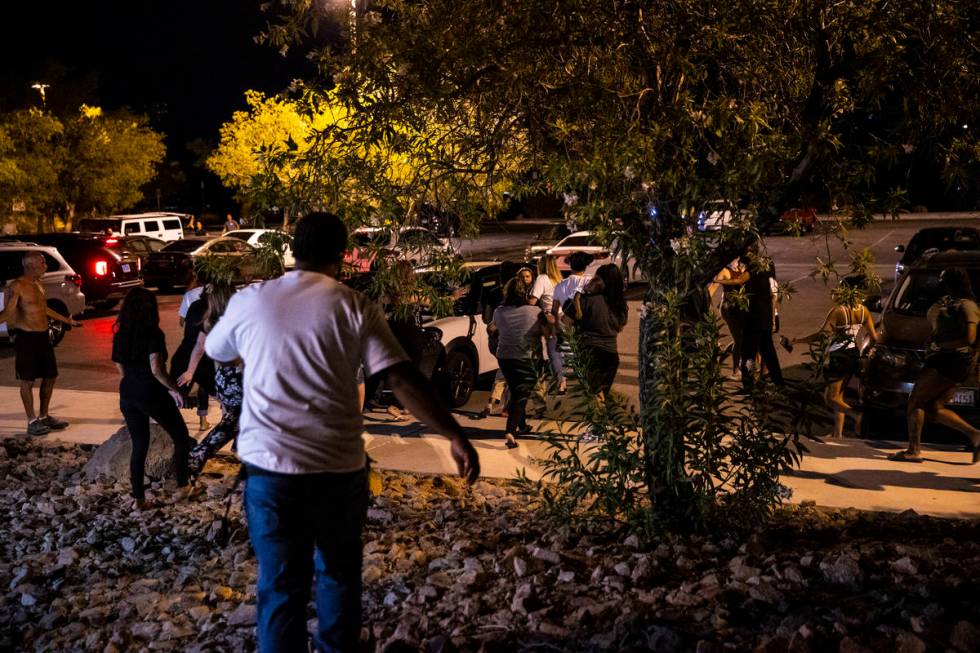 An argument breaks out during a vigil at Buckskin Basin Parkin Las Vegas on Thursday, July 16, ...