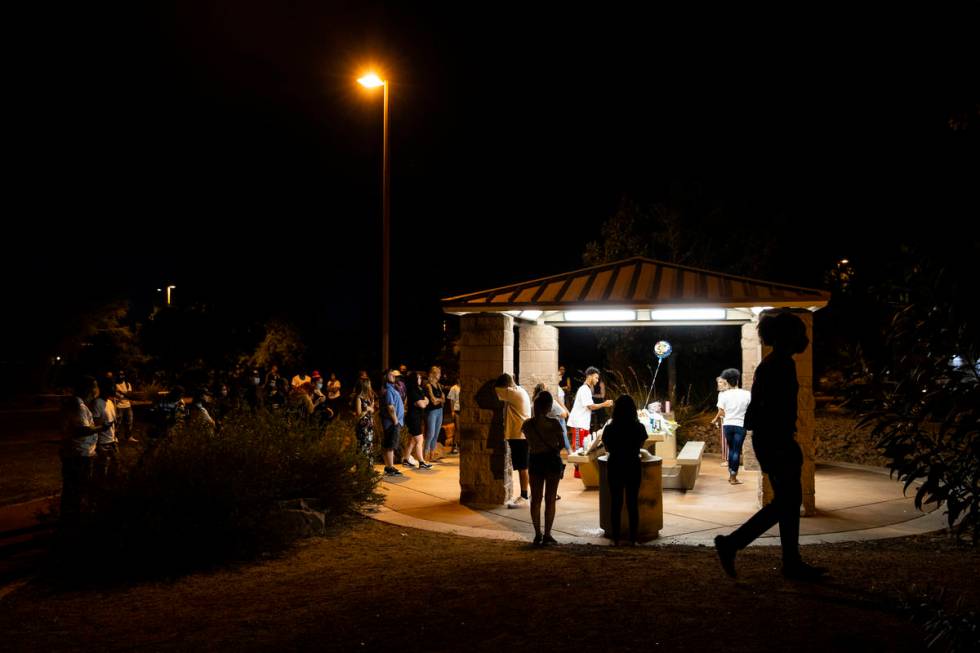 An argument breaks out during a vigil at Buckskin Basin Parkin Las Vegas on Thursday, July 16, ...