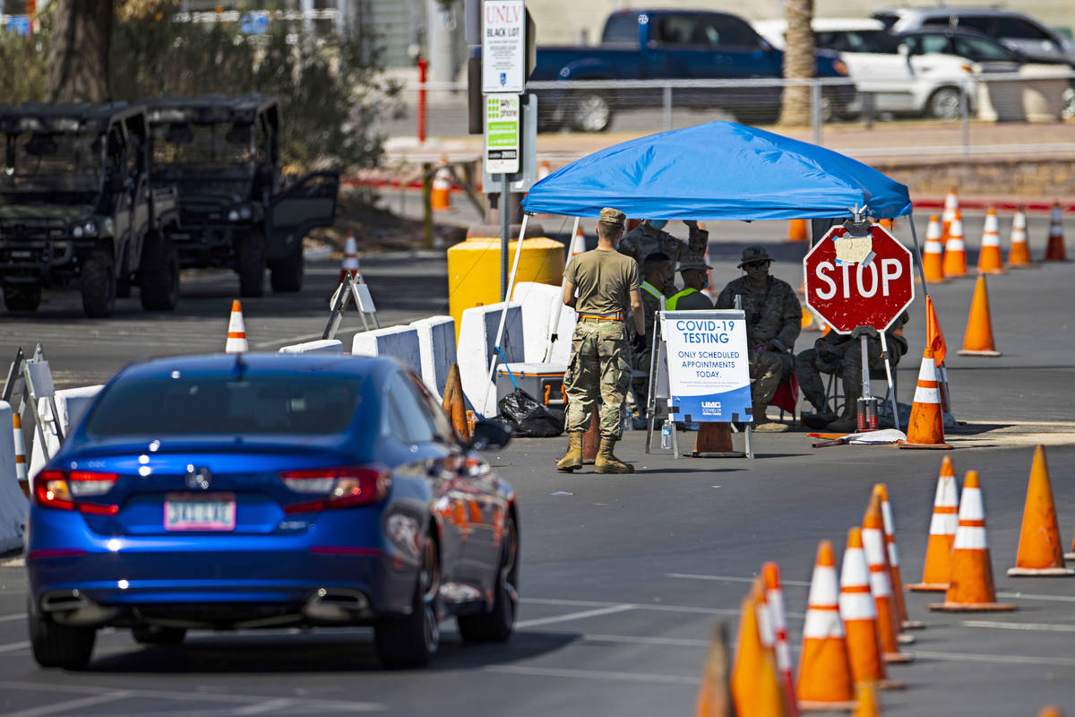 People line up at the UNLV coronavirus testing site in Las Vegas on Thursday, July 16, 2020. (C ...