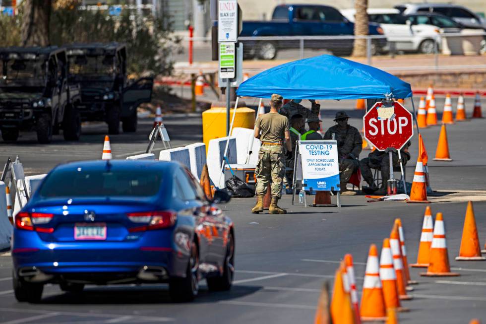 People line up at the UNLV coronavirus testing site in Las Vegas on Thursday, July 16, 2020. (C ...