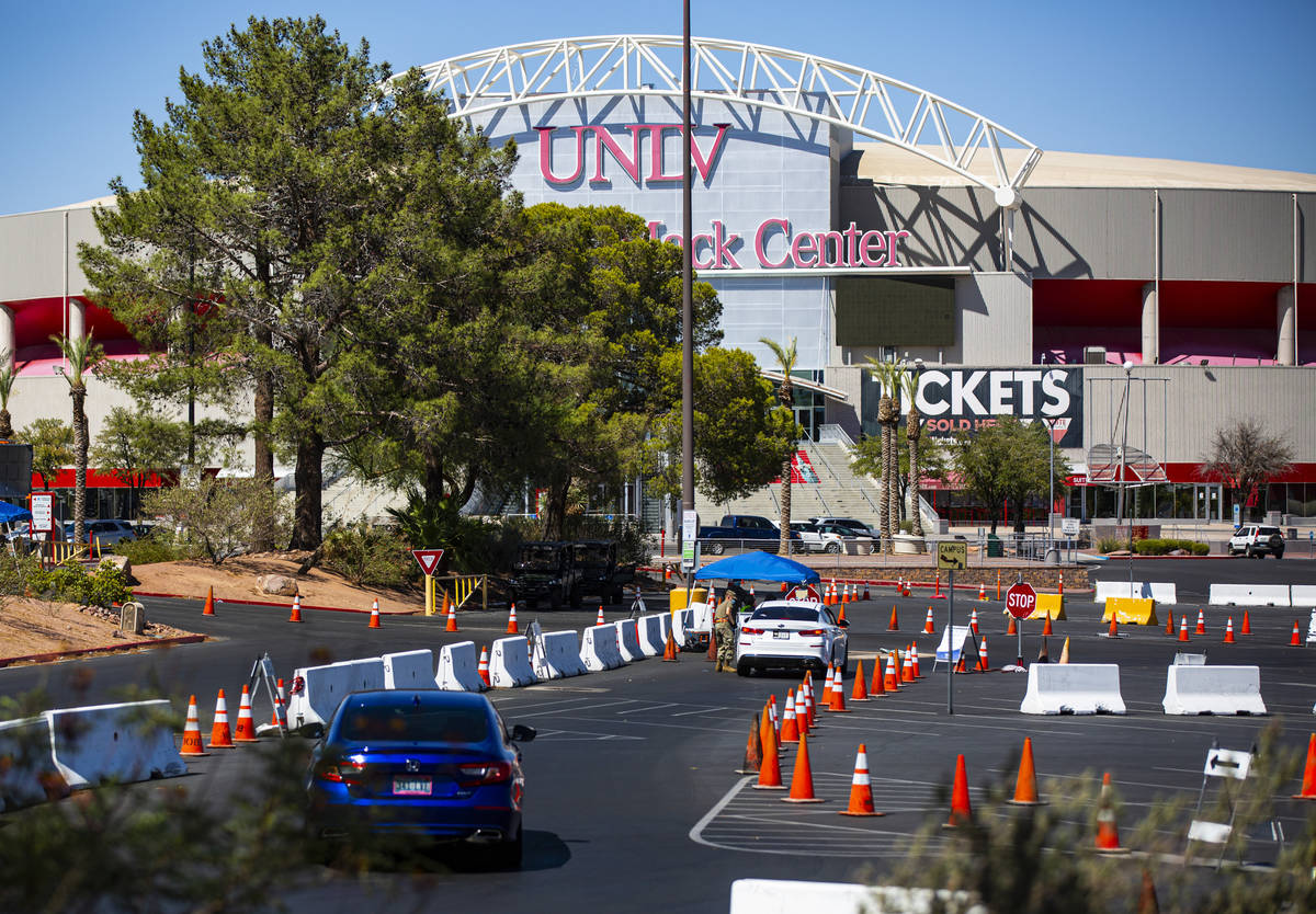 People line up at the UNLV coronavirus testing site in Las Vegas on Thursday, July 16, 2020. (C ...