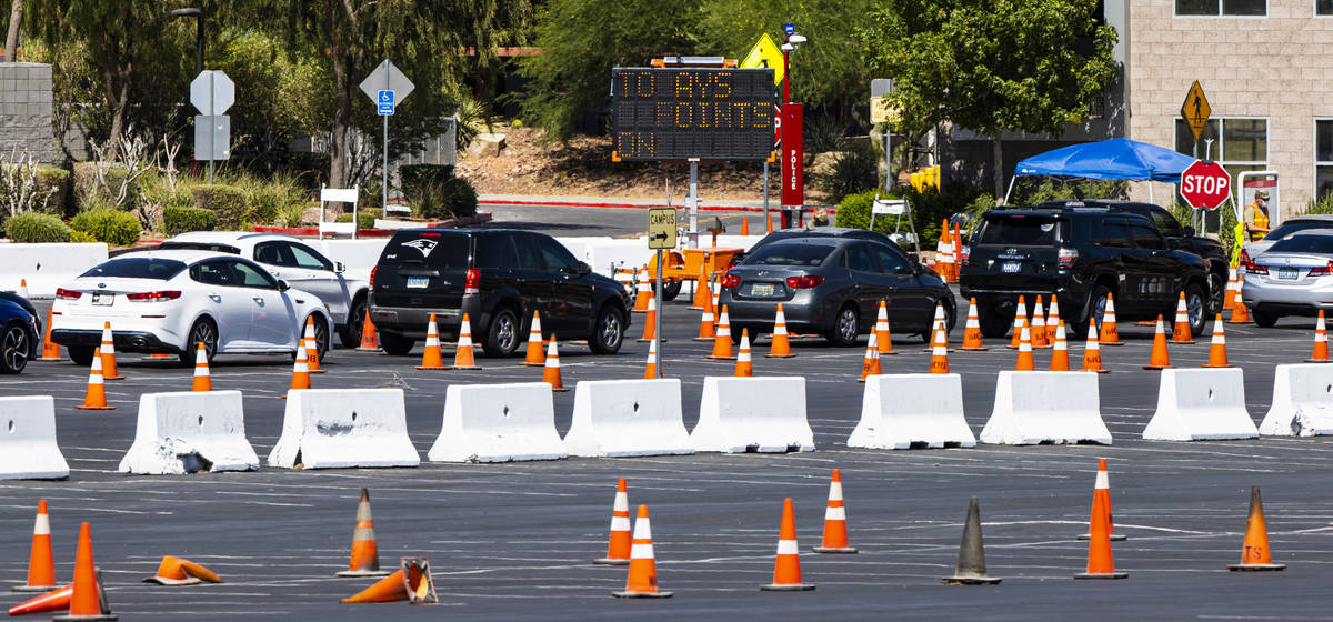 People line up at the UNLV coronavirus testing site in Las Vegas on Thursday, July 16, 2020. (C ...