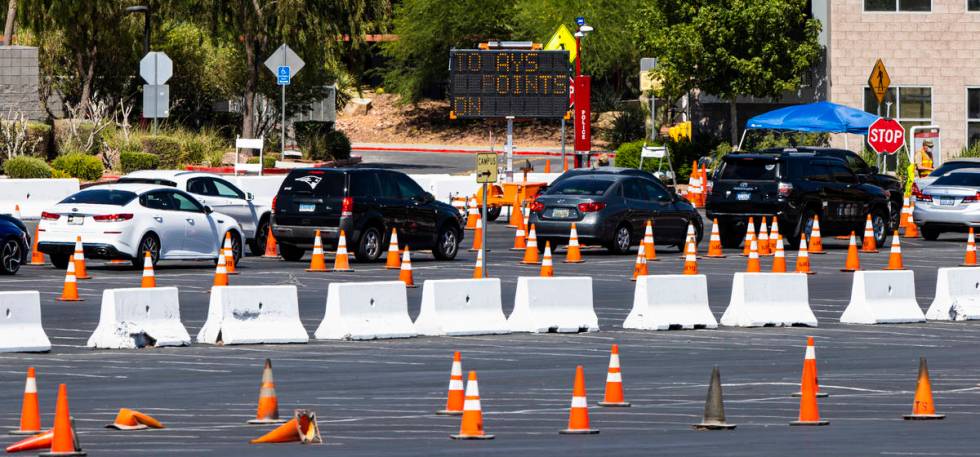 People line up at the UNLV coronavirus testing site in Las Vegas on Thursday, July 16, 2020. (C ...