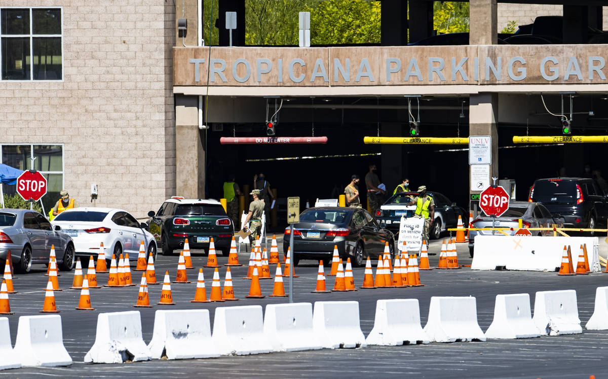 People line up at the UNLV coronavirus testing site in Las Vegas on Thursday, July 16, 2020. (C ...