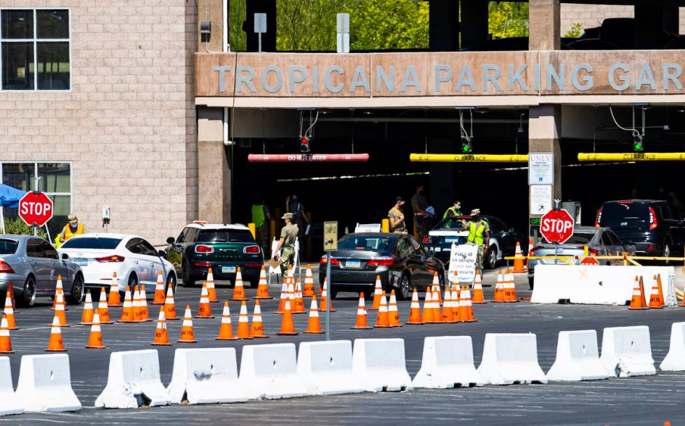 People line up at the UNLV coronavirus testing site in Las Vegas on Thursday, July 16, 2020. (C ...