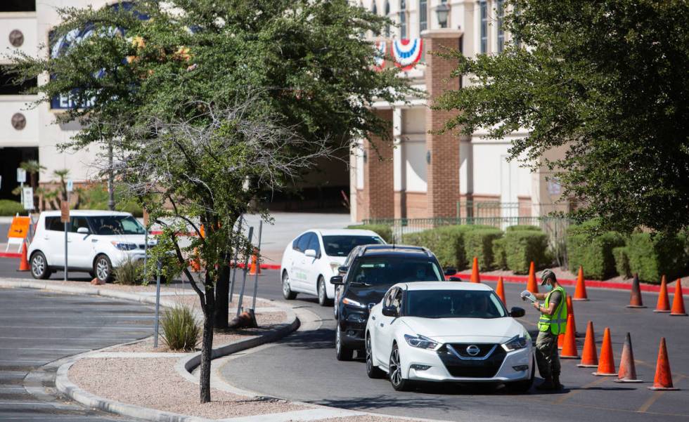 People line up for a coronavirus testing site at Texas Station in Las Vegas on Thursday, July 1 ...