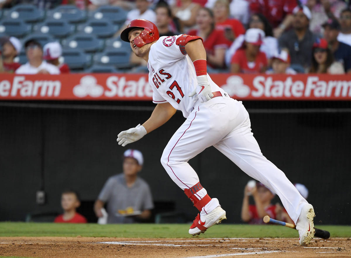FILE - In this July 27, 2019, file photo, Los Angeles Angels' Mike Trout runs to first while wa ...