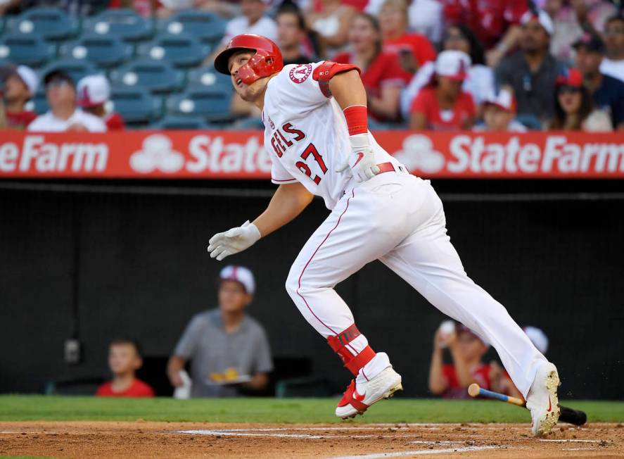 FILE - In this July 27, 2019, file photo, Los Angeles Angels' Mike Trout runs to first while wa ...