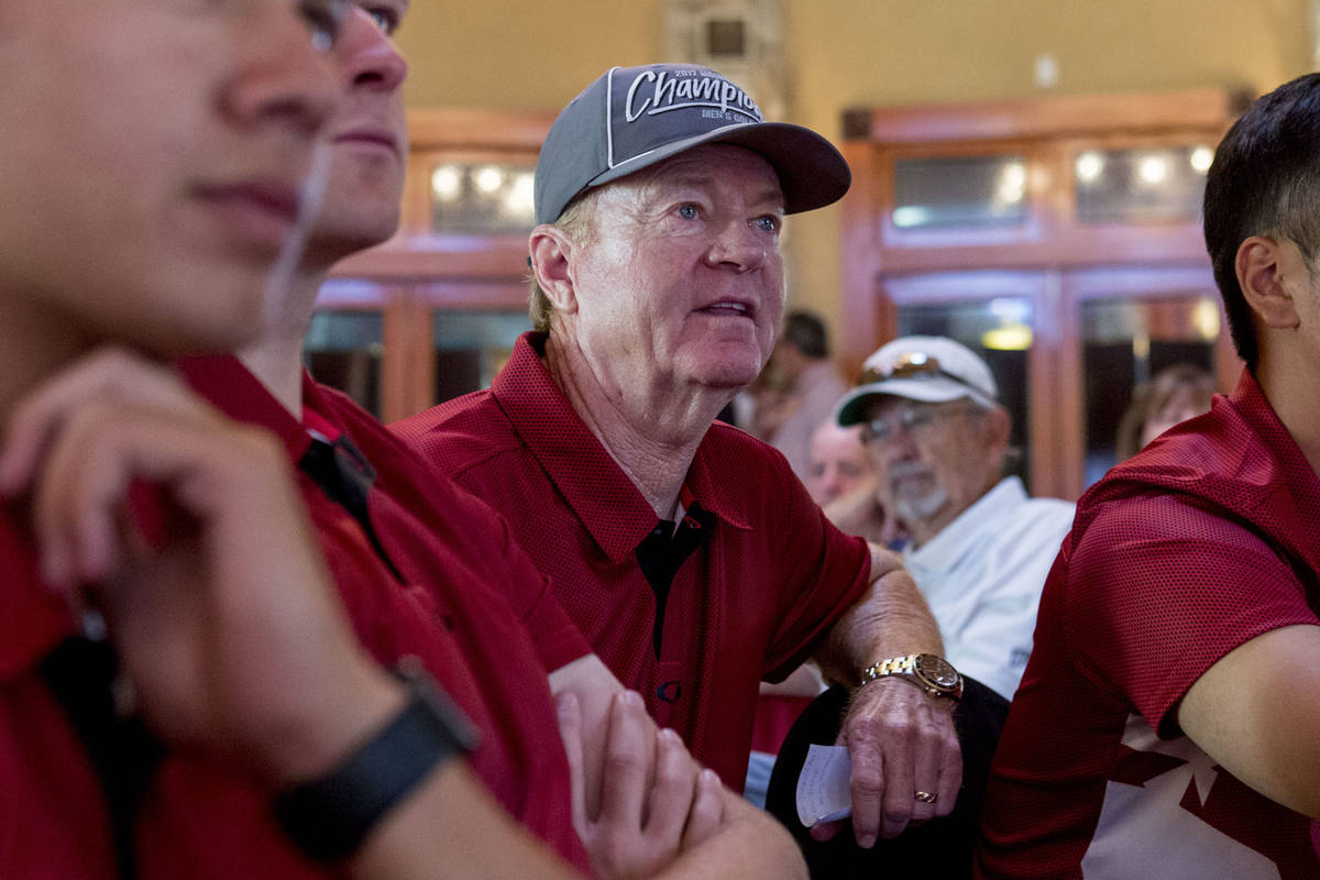 UNLV men's golf head choach Dwaine Knight, center, waits with his team to hear where they will ...