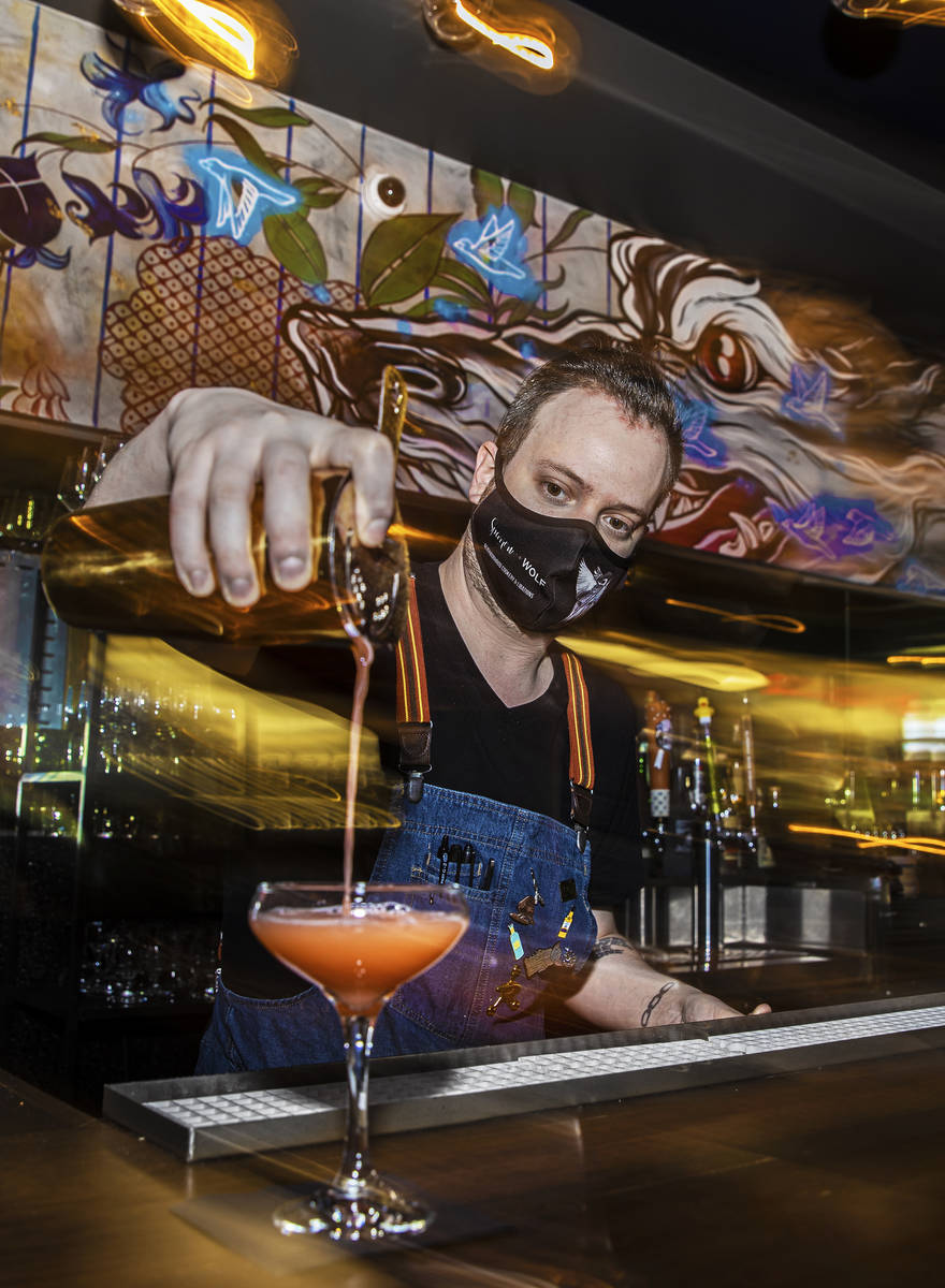 Bartender Ilan Miller makes a cocktail at Sparrow + Wolf on Tuesday, July 14, 2020, in Las Vega ...
