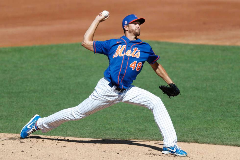 New York Mets starting pitcher Jacob deGrom winds up before delivering a pitch during a simulat ...