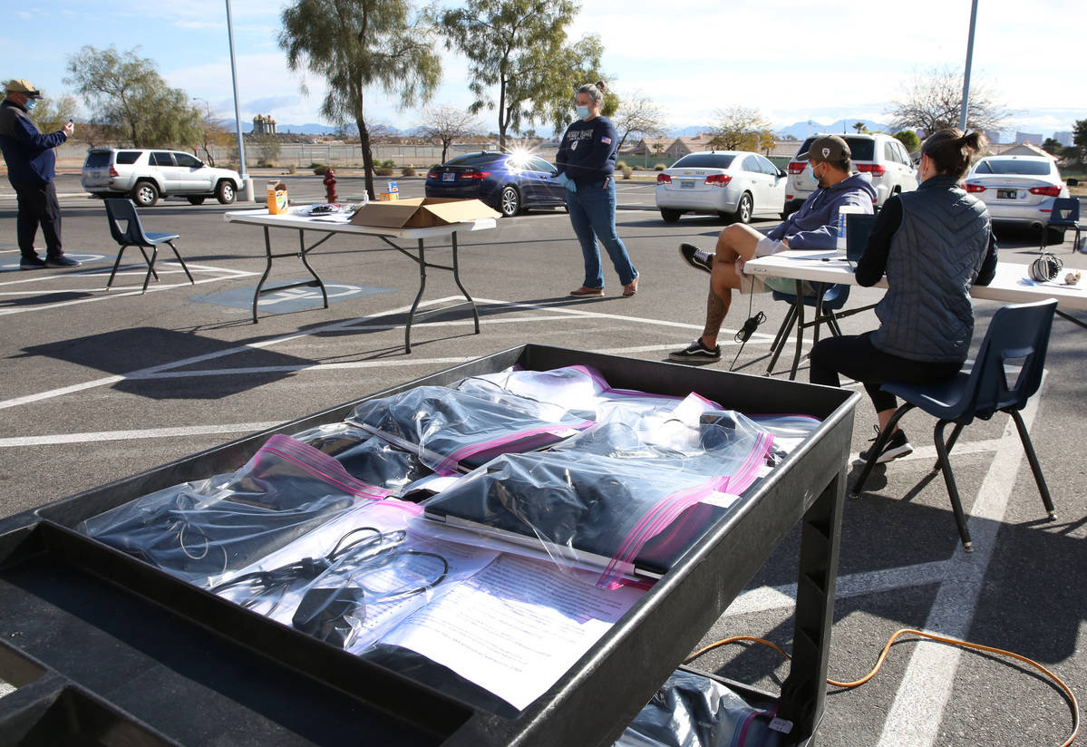 Spring Valley High School staffs prepare to hand out Chromebooks to students on Friday, March 2 ...