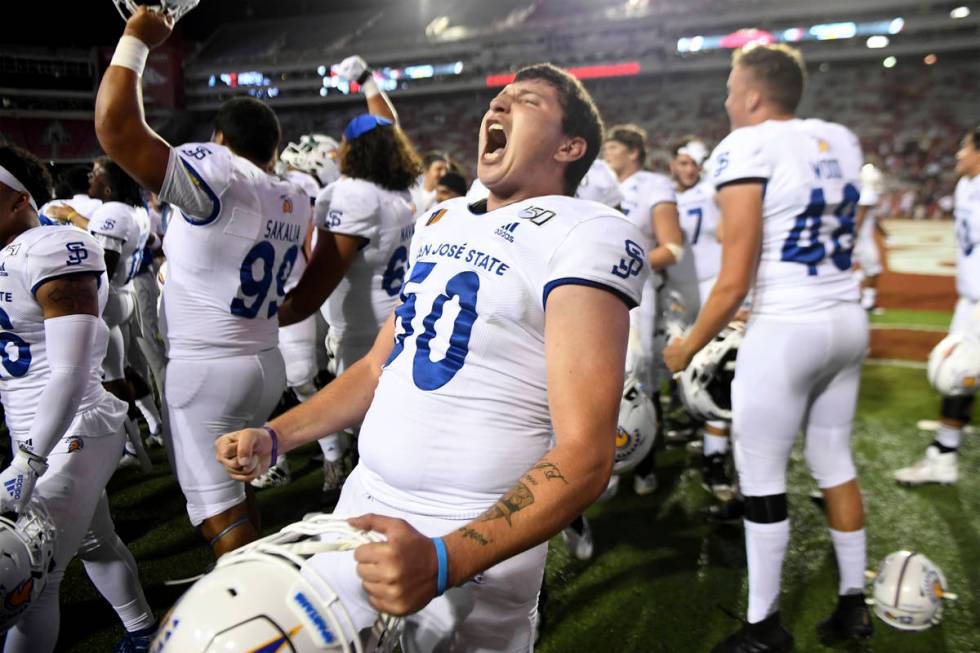 San Jose State's Will Butler celebrates with teammates after they defeated Arkansas 31-24 durin ...