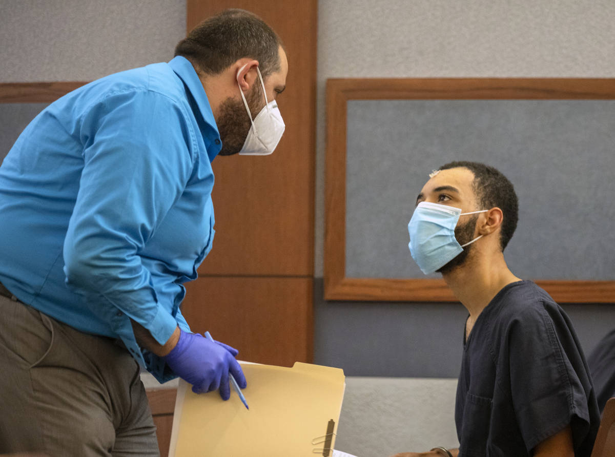 Attorney Damian Sheets, left, speaks to Cameron Hubbard-Jones in the courtroom of Las Vegas Jus ...