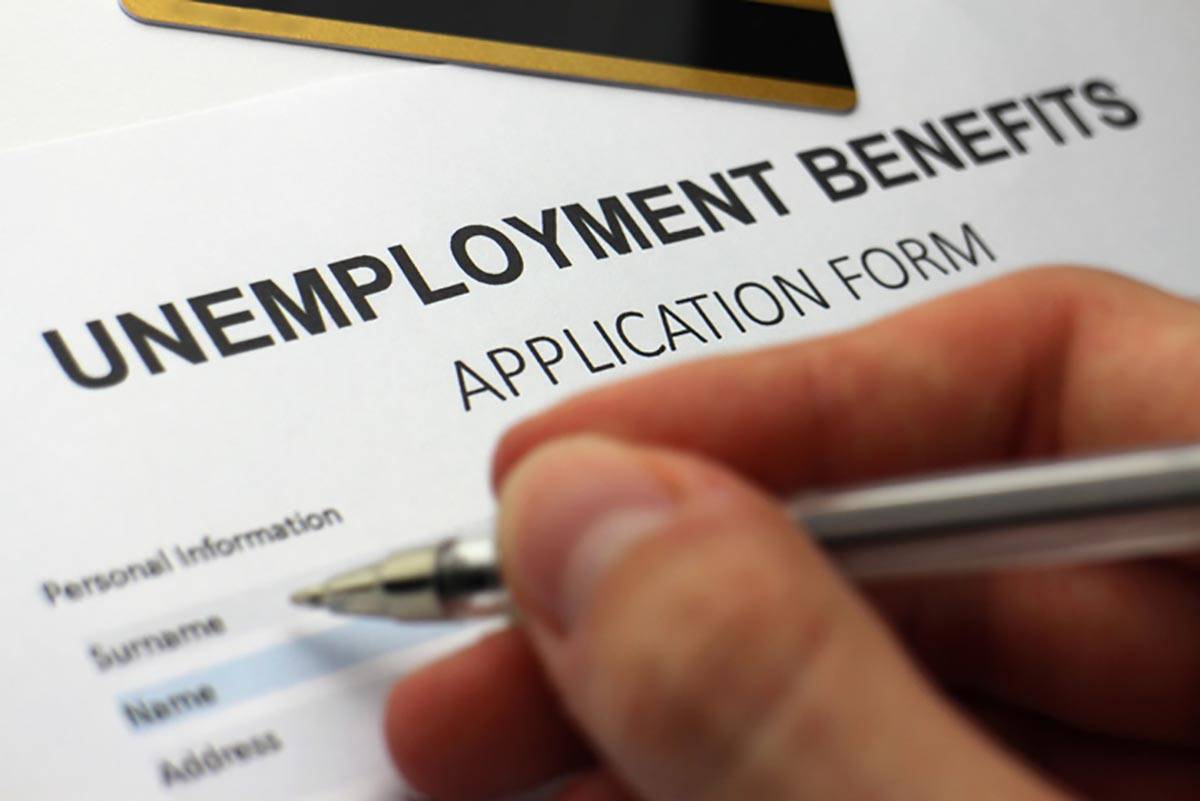Someone completing an unemployment benefits form.In March, the $2 trillion Coronavirus Aid, Rel ...