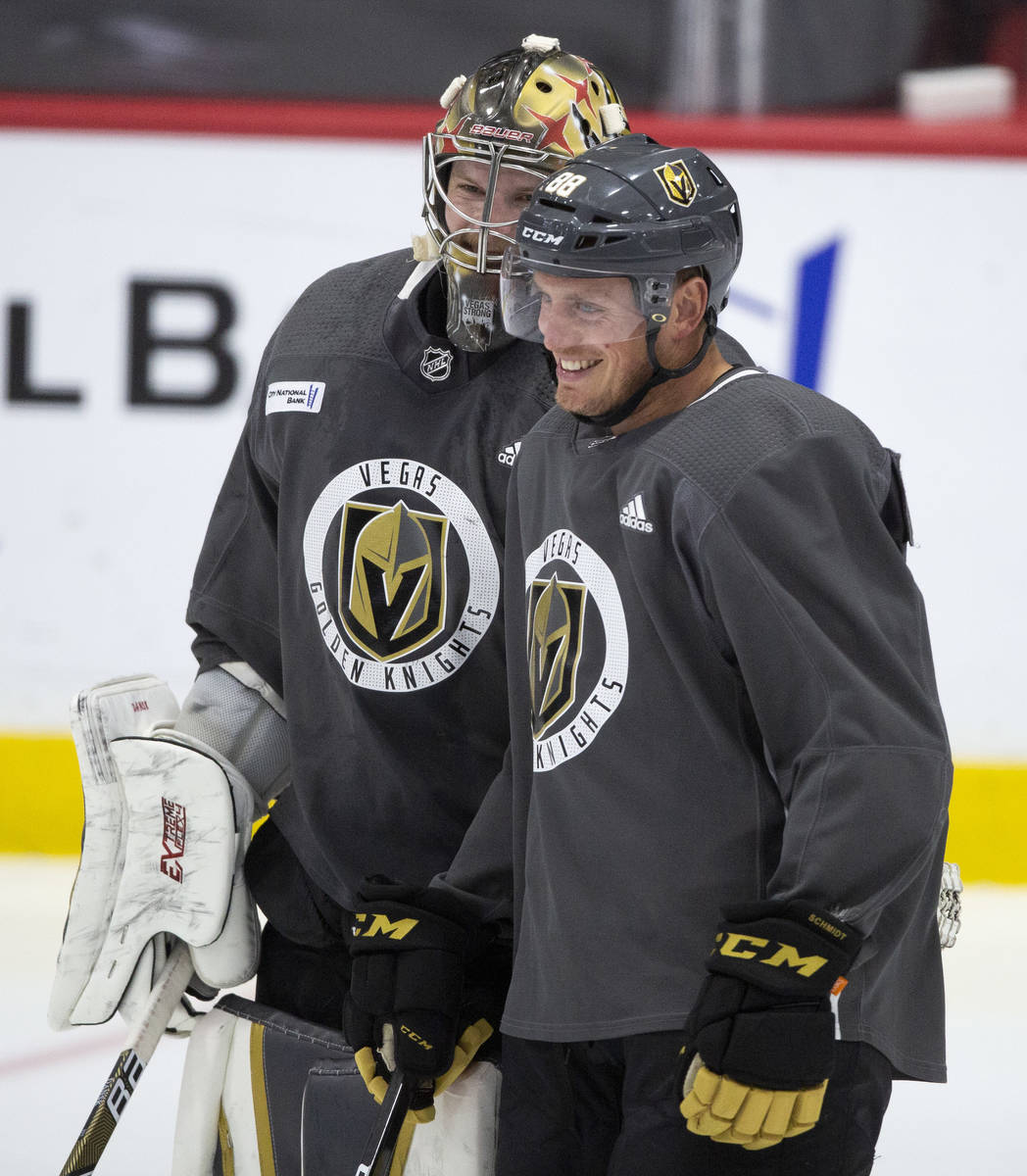 Golden Knights' defenseman Nate Schmidt (88) laughs with goaltender Robin Lehner (90) during pr ...