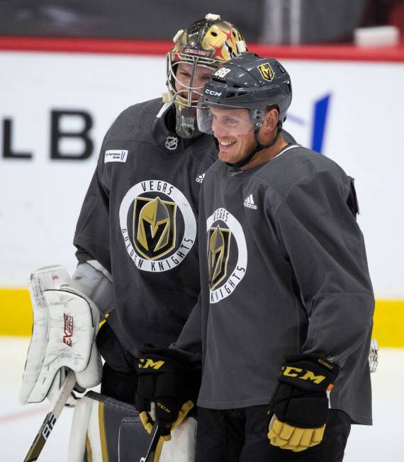 Golden Knights' defenseman Nate Schmidt (88) laughs with goaltender Robin Lehner (90) during pr ...