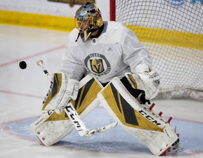 Golden Knights' goaltender Marc-Andre Fleury (29) eyes the puck before making a save during pra ...