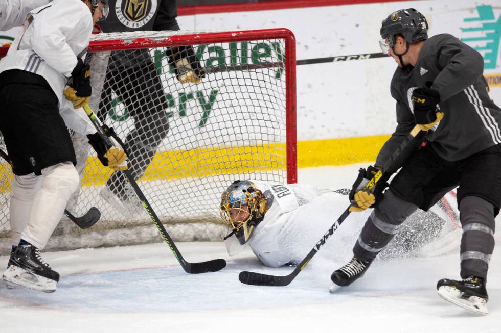 Golden Knights' goaltender Marc-Andre Fleury (29) dives to save the puck during practice at Cit ...