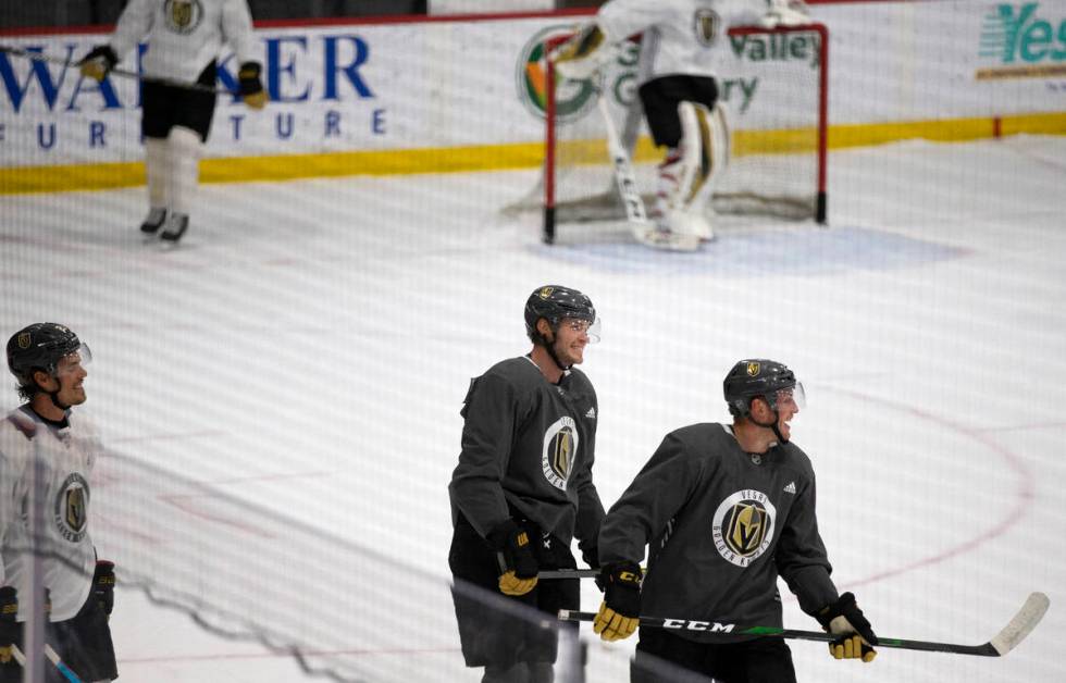 Golden Knights' defensemen Brayden McNabb (3) and Nate Schmidt (88) have fun during practice at ...