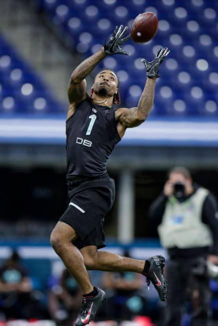 Ohio State defensive back Damon Arnette runs a drill at the NFL football scouting combine in In ...