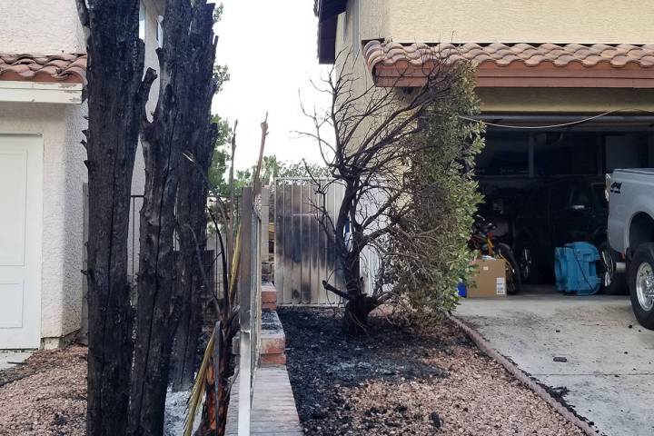 Damage is seen from a fire that started outside a home on the 8600 block of Catalonia Drive in ...
