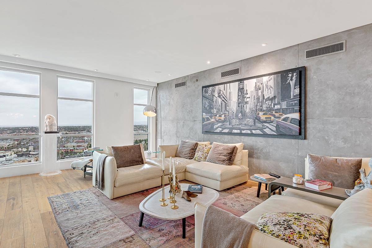 This One Queensridge Place penthouse showcases a great room with views of the valley. (Luxe Est ...