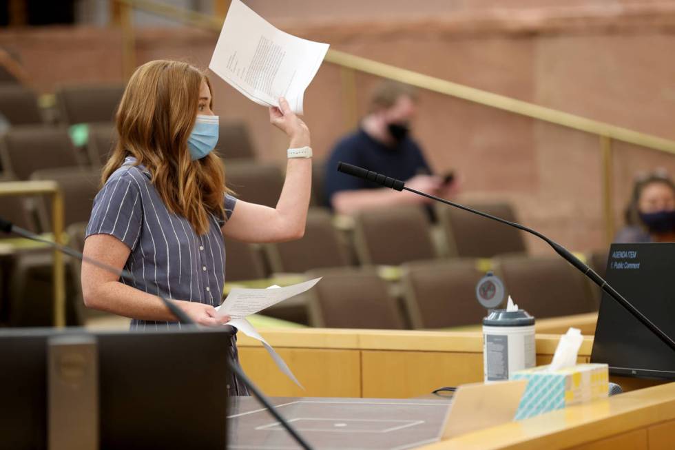 Kristen Corral, owner of Tacotarian restaurant, holds up letters from fellow restaurant owners ...