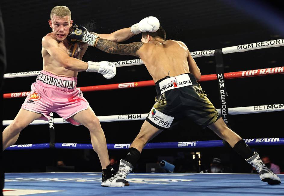 Oscar Valdez, right, and Jayson Velez trade punches during their junior lightweight fight on Tu ...