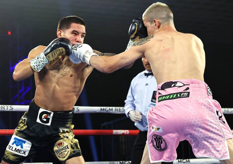 Oscar Valdez, left, and Jayson Velez trade punches during their junior lightweight fight on Tue ...